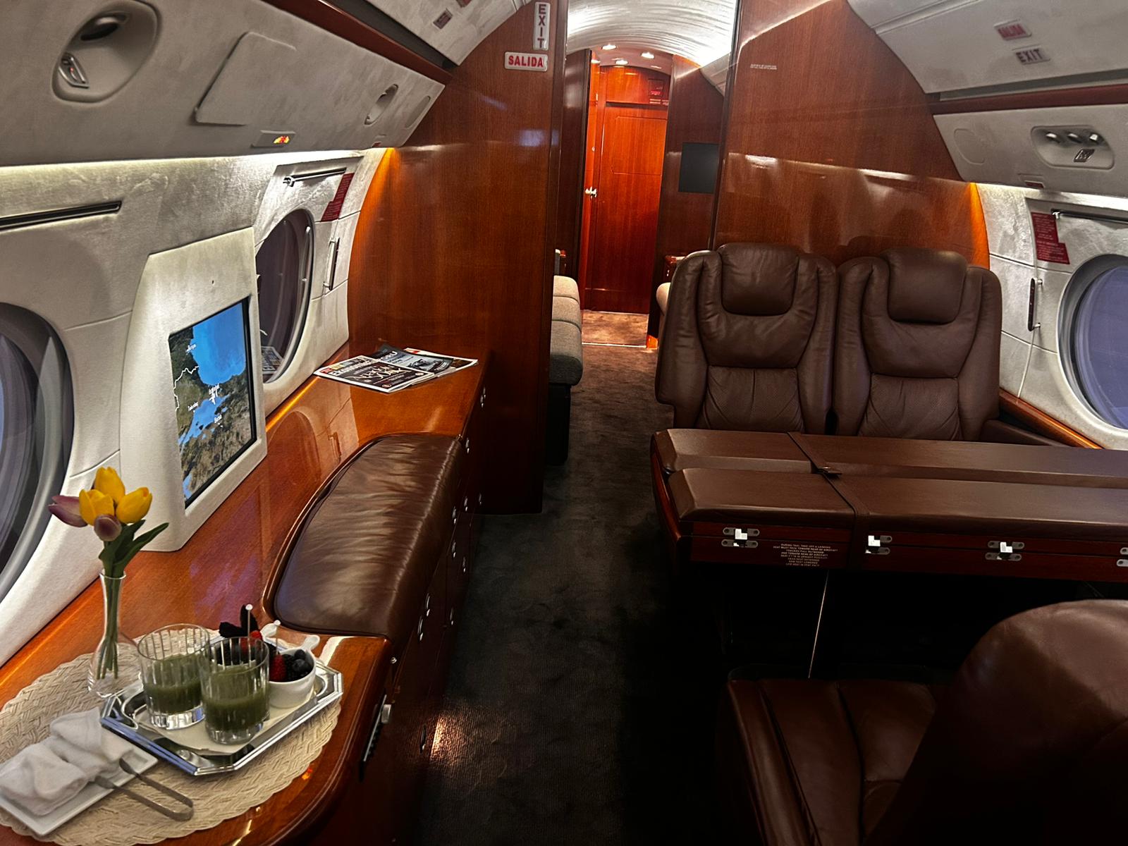 Private jet club seating and entertainment screen